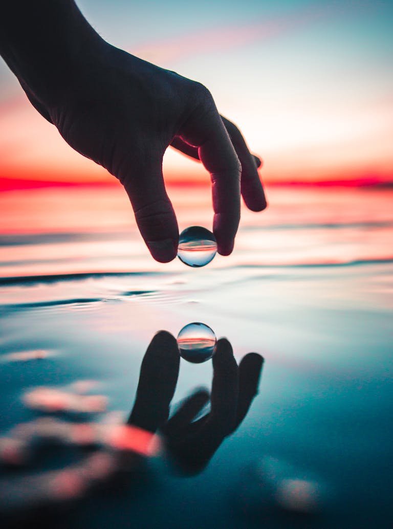 Person Holding Marble Toy